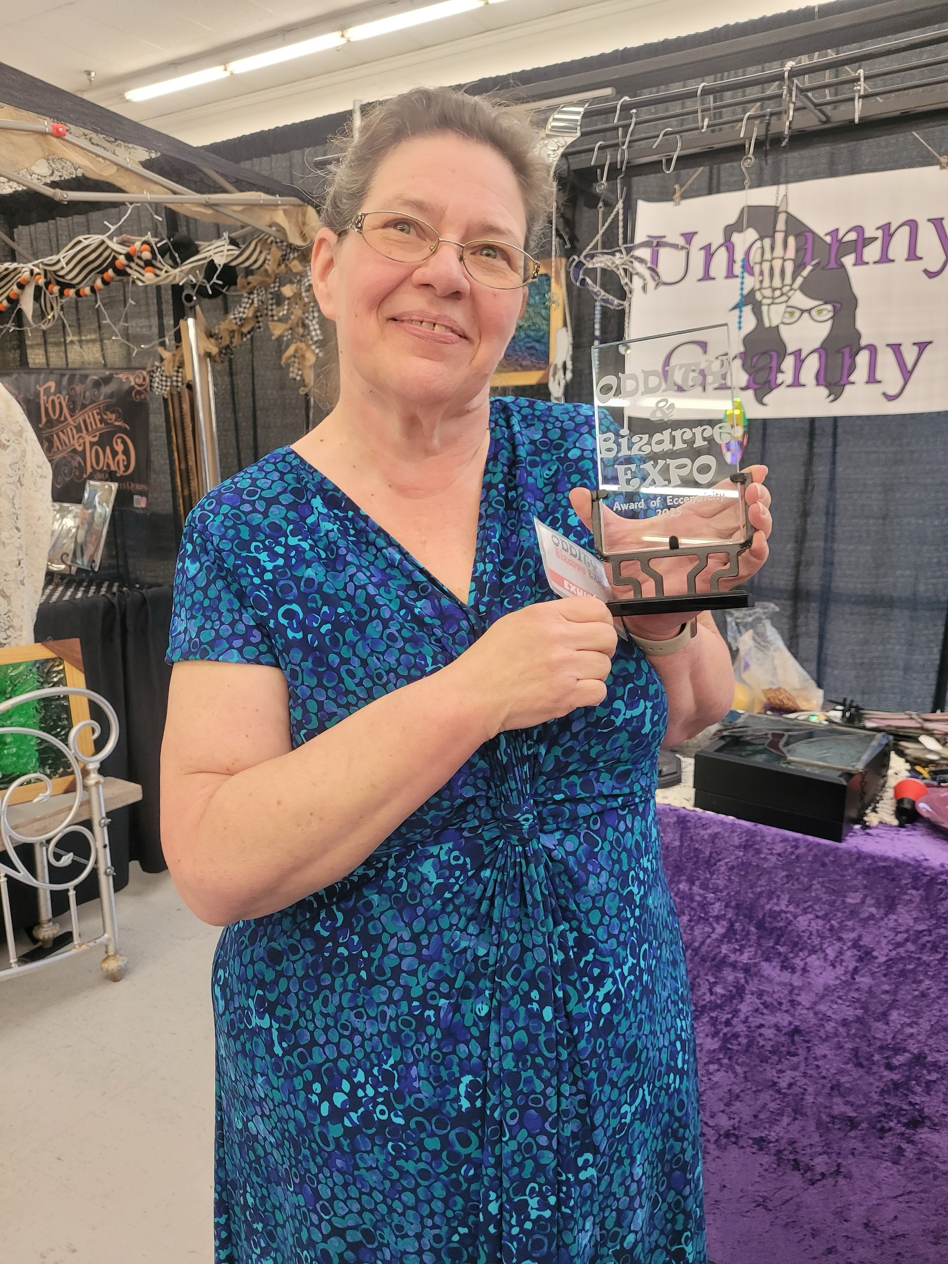 Debbie holding a Best in Show award